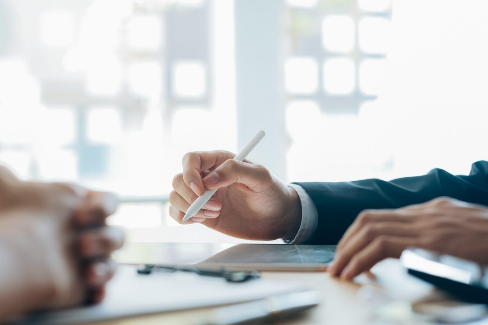 A person holding a pen