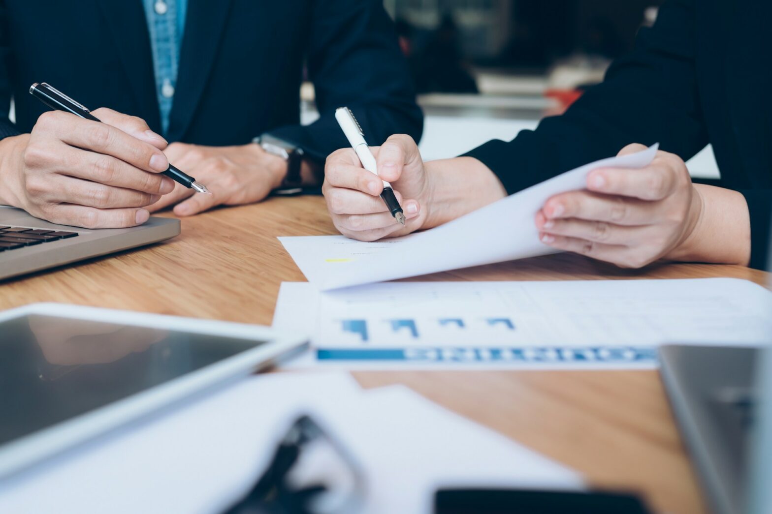 A person writing on a paper