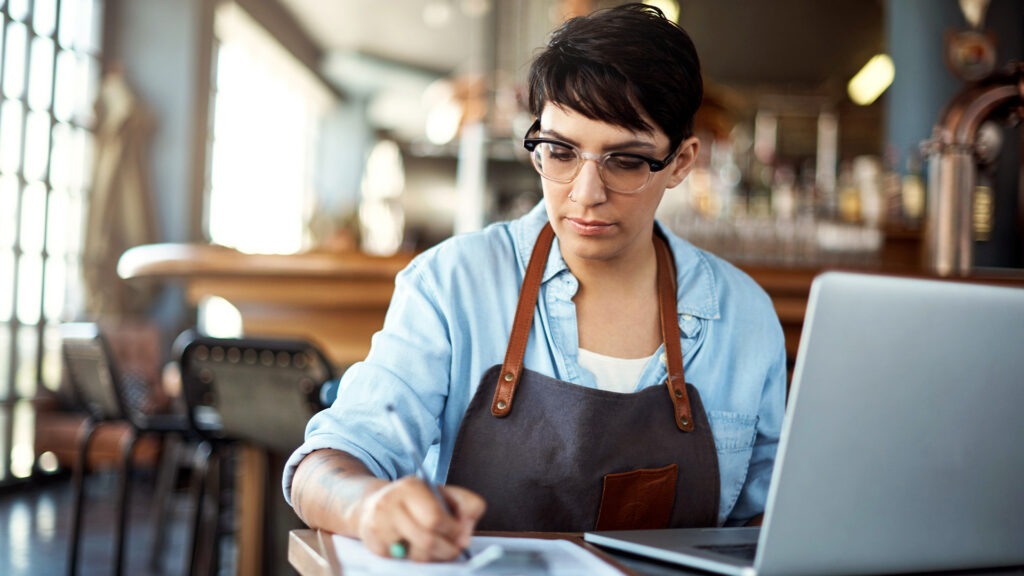 a small business owner working on inventory